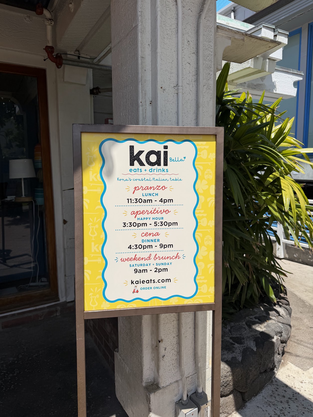 Kai Eats + Drinks sidewalk sign — Kona’s coastal Italian table