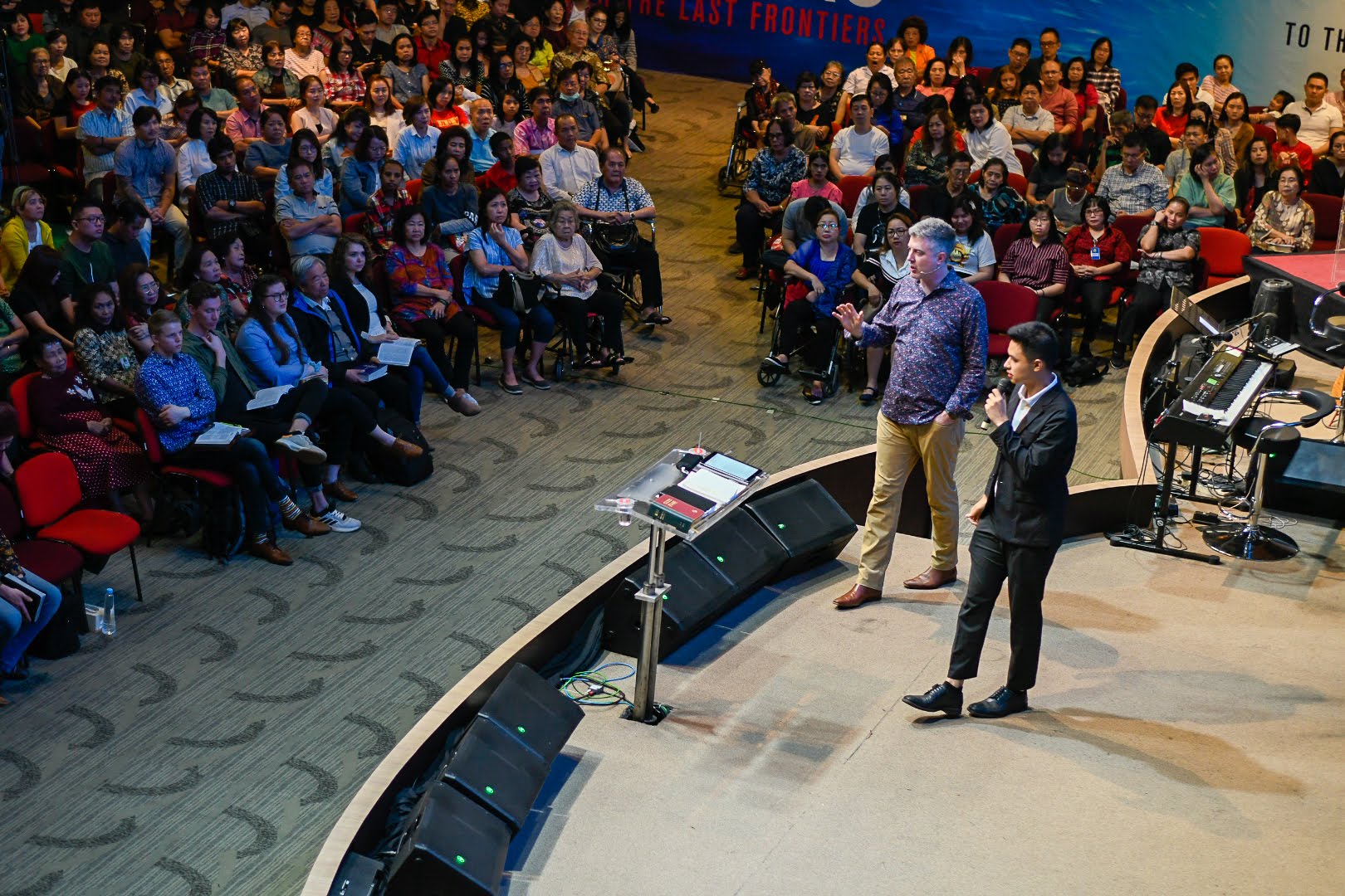 On stage translating live for a large crowd
