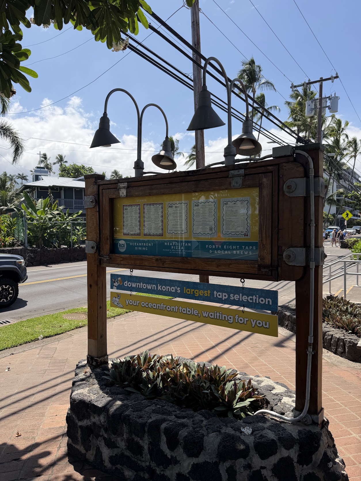 Kai Eats display case with printed menus on Aliʻi Drive